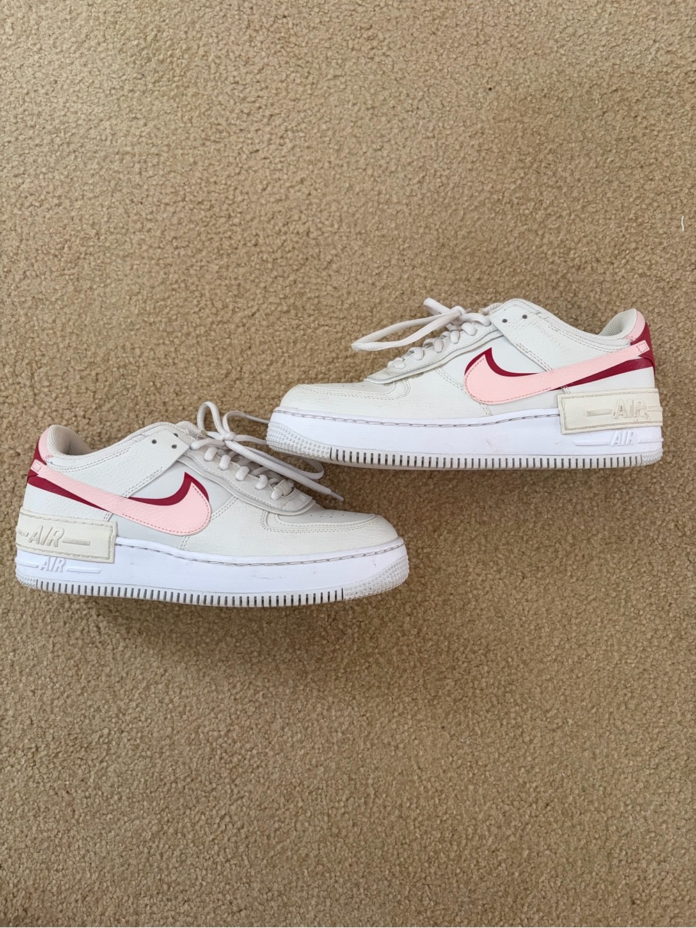 Nike Kids Low-Top Sneakers in White with Pink and Red Swoosh